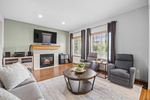 4446 Elgin Avenue Se, Calgary, AB - Indoor Photo Showing Living Room With Fireplace