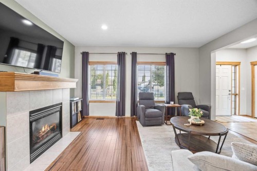 4446 Elgin Avenue Se, Calgary, AB - Indoor Photo Showing Living Room With Fireplace