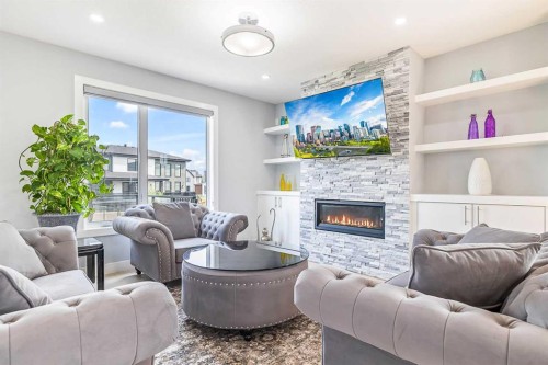 308 Grange Lane, Conrich, AB - Indoor Photo Showing Living Room With Fireplace