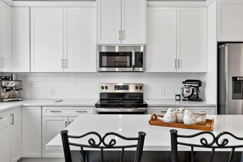 132 Creekside Drive Sw, Calgary, AB - Indoor Photo Showing Kitchen With Stainless Steel Kitchen With Upgraded Kitchen