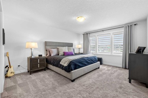 132 Creekside Drive Sw, Calgary, AB - Indoor Photo Showing Bedroom