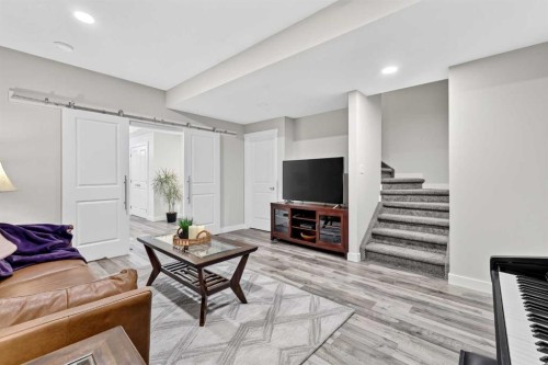 132 Creekside Drive Sw, Calgary, AB - Indoor Photo Showing Living Room