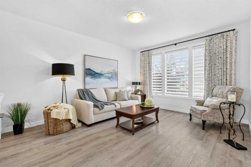 132 Creekside Drive Sw, Calgary, AB - Indoor Photo Showing Living Room