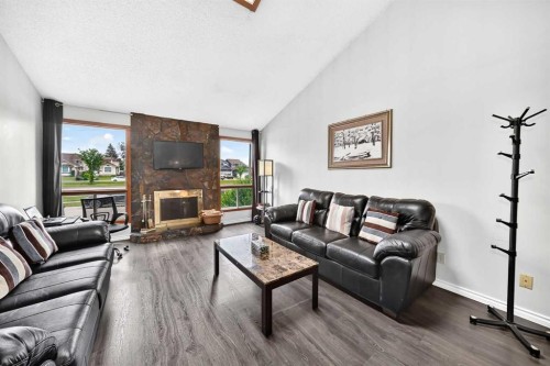91 Castleridge Crescent Ne, Calgary, AB - Indoor Photo Showing Living Room With Fireplace