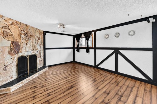 91 Castleridge Crescent Ne, Calgary, AB - Indoor Photo Showing Other Room With Fireplace