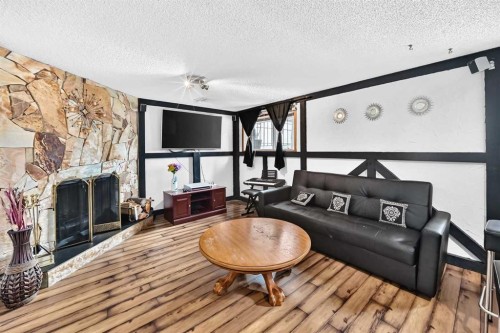 91 Castleridge Crescent Ne, Calgary, AB - Indoor Photo Showing Other Room With Fireplace