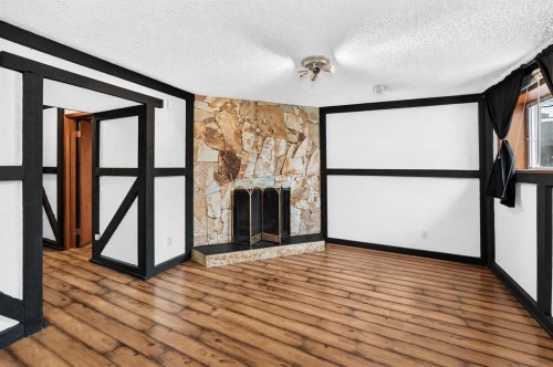 91 Castleridge Crescent Ne, Calgary, AB - Indoor With Fireplace