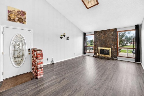 91 Castleridge Crescent Ne, Calgary, AB - Indoor Photo Showing Living Room With Fireplace