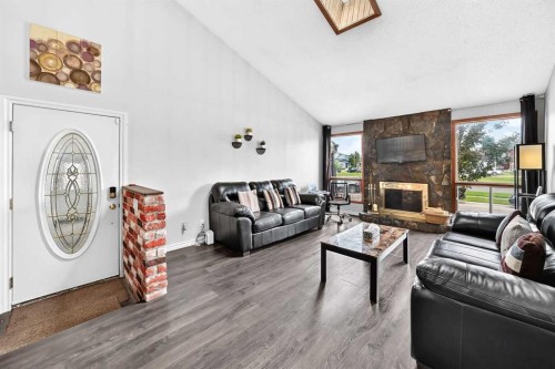 91 Castleridge Crescent Ne, Calgary, AB - Indoor Photo Showing Living Room With Fireplace