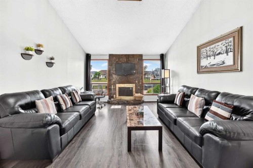 91 Castleridge Crescent Ne, Calgary, AB - Indoor Photo Showing Living Room With Fireplace