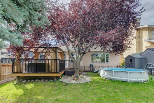 190 Mt Robson Close Se, Calgary, AB - Outdoor With Above Ground Pool With Deck Patio Veranda With Backyard