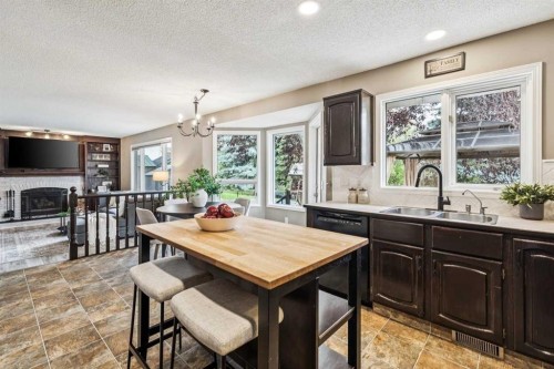190 Mt Robson Close Se, Calgary, AB - Indoor Photo Showing Dining Room With Fireplace
