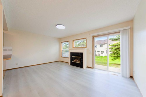 88 Country Hills Villas Nw, Calgary, AB - Indoor Photo Showing Other Room With Fireplace