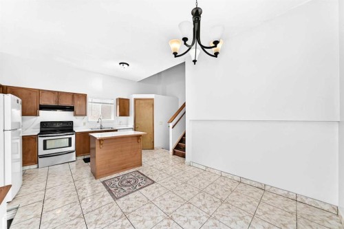 6934 Laguna Way Ne, Calgary, AB - Indoor Photo Showing Kitchen With Double Sink