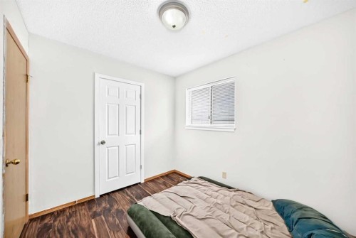 6934 Laguna Way Ne, Calgary, AB - Indoor Photo Showing Bedroom