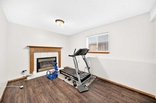 6934 Laguna Way Ne, Calgary, AB - Indoor Photo Showing Gym Room