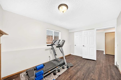 6934 Laguna Way Ne, Calgary, AB - Indoor Photo Showing Gym Room