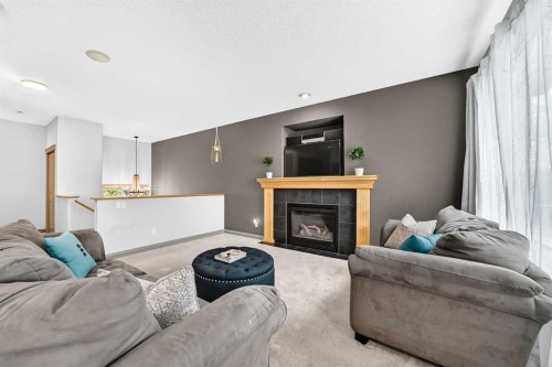 59 Prestwick Street Se, Calgary, AB - Indoor Photo Showing Living Room With Fireplace