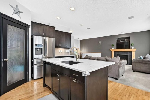 59 Prestwick Street Se, Calgary, AB - Indoor Photo Showing Kitchen With Fireplace With Upgraded Kitchen