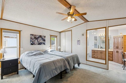 25 Erin Woods Circle Se, Calgary, AB - Indoor Photo Showing Bedroom