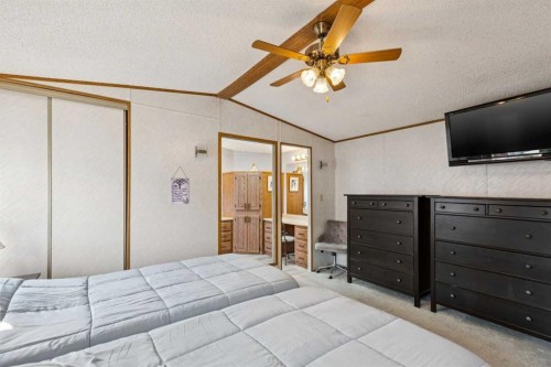 25 Erin Woods Circle Se, Calgary, AB - Indoor Photo Showing Bedroom