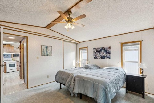 25 Erin Woods Circle Se, Calgary, AB - Indoor Photo Showing Bedroom
