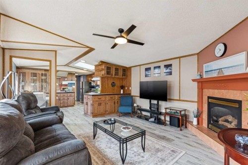 25 Erin Woods Circle Se, Calgary, AB - Indoor Photo Showing Living Room With Fireplace