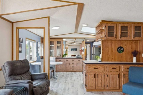 25 Erin Woods Circle Se, Calgary, AB - Indoor Photo Showing Living Room