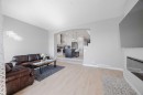 44 Calhoun Common Ne, Calgary, AB  - Indoor Photo Showing Living Room With Fireplace 