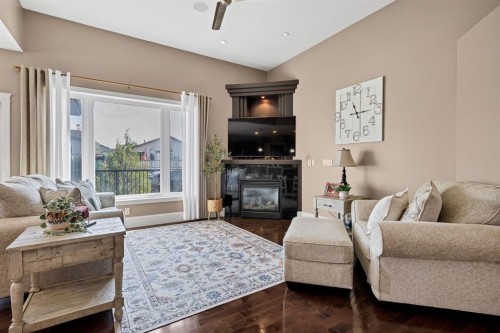 9 Liberty Place, Sylvan Lake, AB - Indoor Photo Showing Living Room With Fireplace