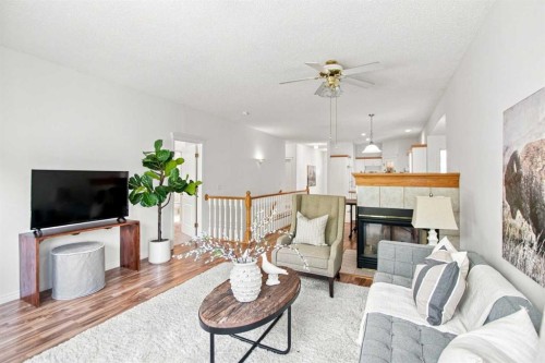 21 Scimitar Heath Nw, Calgary, AB - Indoor Photo Showing Living Room With Fireplace