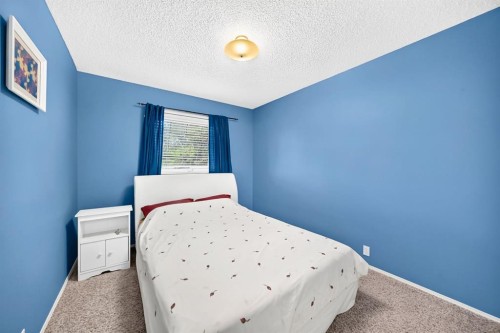 14954 Mt Mckenzie Drive Se, Calgary, AB - Indoor Photo Showing Bedroom