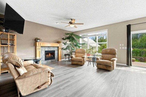 5355 Copperfield Gate Se, Calgary, AB - Indoor Photo Showing Living Room With Fireplace