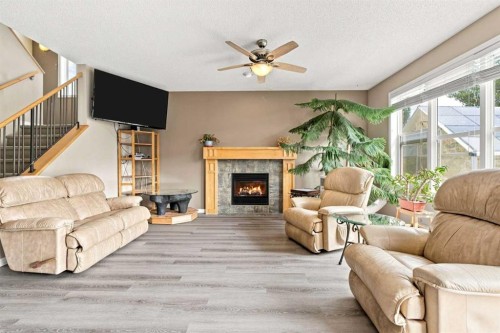 5355 Copperfield Gate Se, Calgary, AB - Indoor Photo Showing Living Room With Fireplace