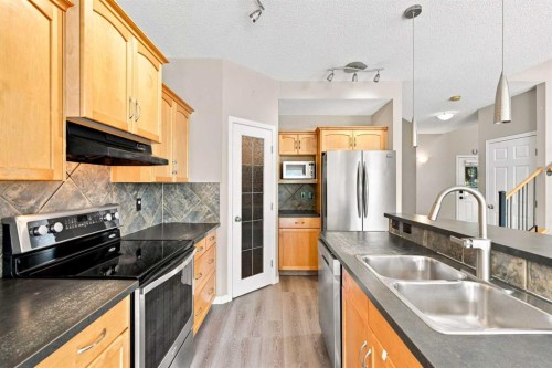 5355 Copperfield Gate Se, Calgary, AB - Indoor Photo Showing Kitchen With Stainless Steel Kitchen With Double Sink With Upgraded Kitchen