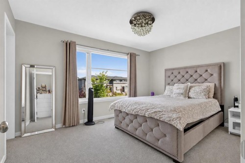 1079  Lanark Boulevard Se, Airdrie, AB - Indoor Photo Showing Bedroom