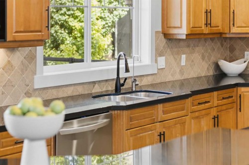 39 Chapala Terrace Se, Calgary, AB - Indoor Photo Showing Kitchen With Double Sink