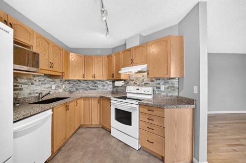 1109-1109 Hawksbrow Point Nw, Calgary, AB - Indoor Photo Showing Kitchen