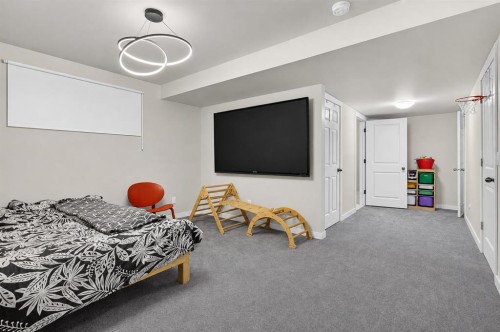 725 New Brighton Drive Se, Calgary, AB - Indoor Photo Showing Bedroom
