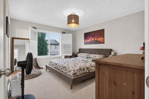 725 New Brighton Drive Se, Calgary, AB - Indoor Photo Showing Bedroom