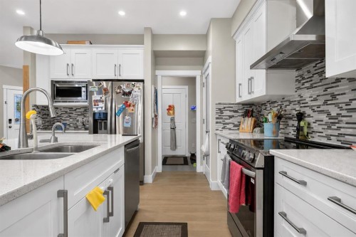 725 New Brighton Drive Se, Calgary, AB - Indoor Photo Showing Kitchen With Double Sink With Upgraded Kitchen