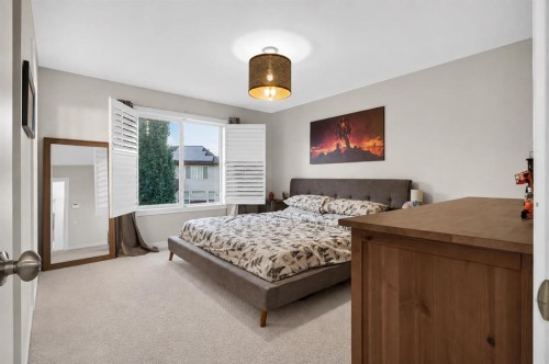 725 New Brighton Drive Se, Calgary, AB - Indoor Photo Showing Bedroom