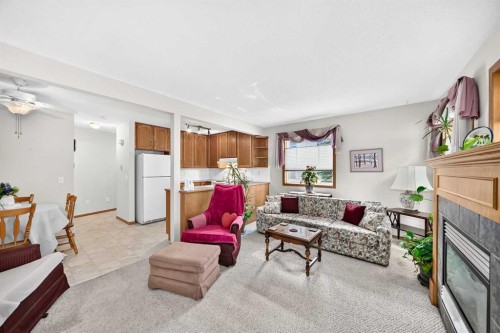 20 Everstone Place Sw, Calgary, AB - Indoor Photo Showing Living Room With Fireplace