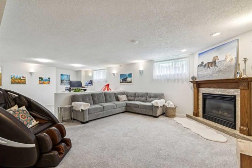 6991 Christie Briar Manor Sw, Calgary, AB - Indoor Photo Showing Living Room With Fireplace