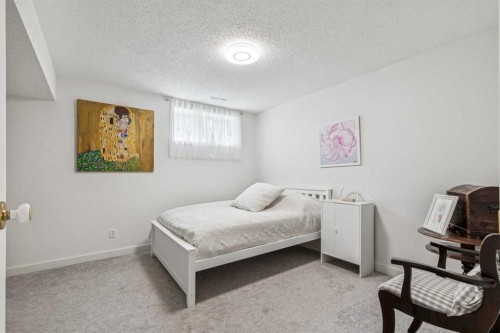 6991 Christie Briar Manor Sw, Calgary, AB - Indoor Photo Showing Bedroom