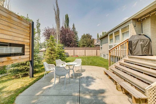 6991 Christie Briar Manor Sw, Calgary, AB - Outdoor With Fireplace
