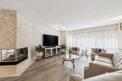 6991 Christie Briar Manor Sw, Calgary, AB - Indoor Photo Showing Living Room With Fireplace