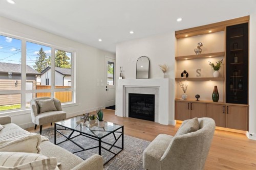 8138 47 Avenue Nw, Calgary, AB - Indoor Photo Showing Living Room With Fireplace