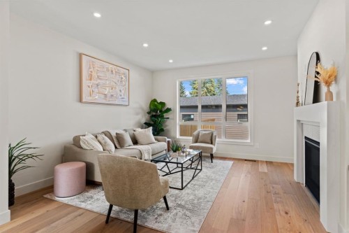 8138 47 Avenue Nw, Calgary, AB - Indoor Photo Showing Living Room With Fireplace