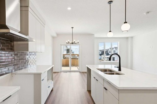69 Heritage Park, Cochrane, AB - Indoor Photo Showing Kitchen With Double Sink With Upgraded Kitchen